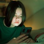 OpenAI to route sensitive conversations to GPT-5, introduce parental controls Portrait of a teenage girl looking at her mobile phone.